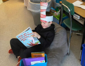 Elementary school boy reading.