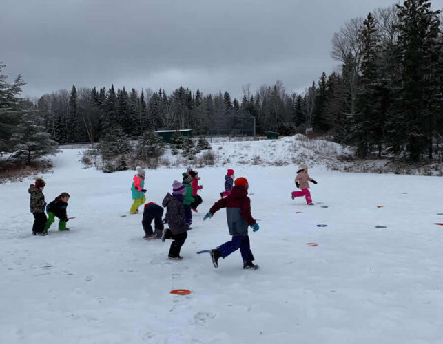 Students playing outside in winter.